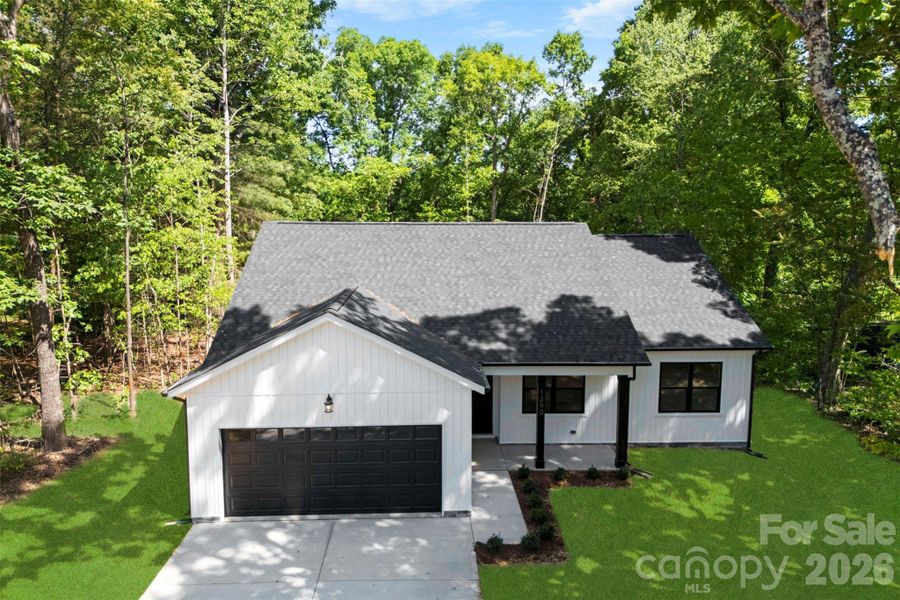 Front exterior of a new home in , Statesville, NC, highlighting curb appeal (Image 29).