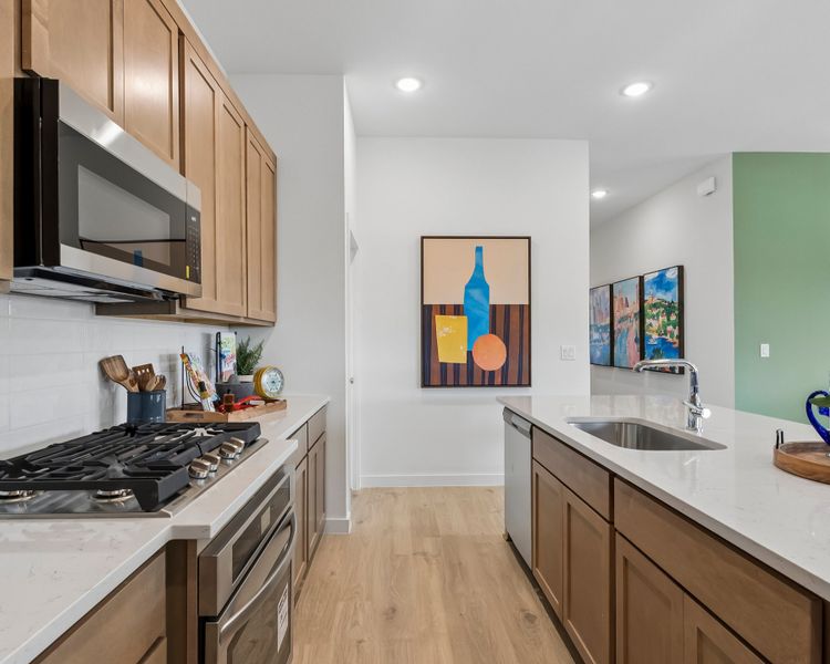 Kitchen in the Pecos home plan by Trophy Signature Homes – REPRESENTATIVE PHOTO