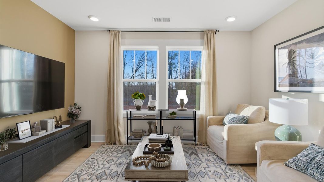 Hardwood flooring enhances the versatility of this elegant upper-level loft space of the villa at Pelham Crossing