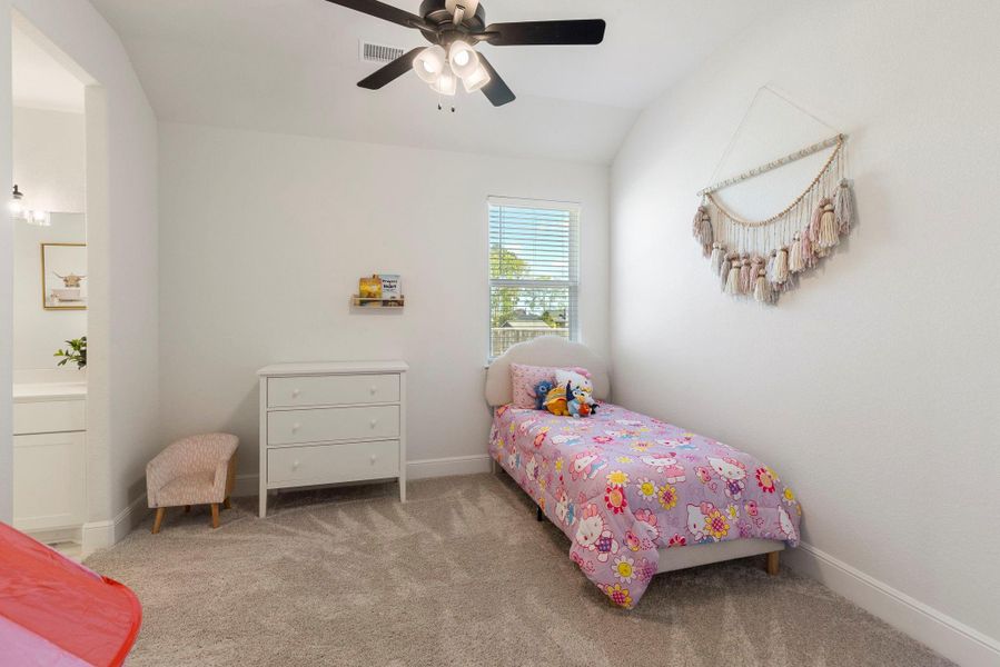 Secondary bedroom complete with ceiling fan.