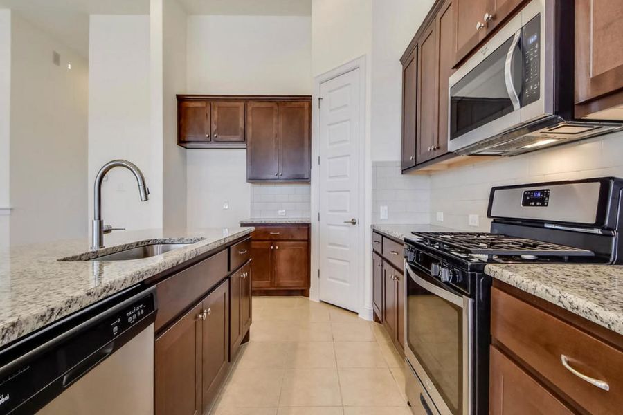 Representative furnished interior of a home built from the Oaks 1596 by Brohn Homes in Oaks at San Gabriel, Georgetown (Image 4).