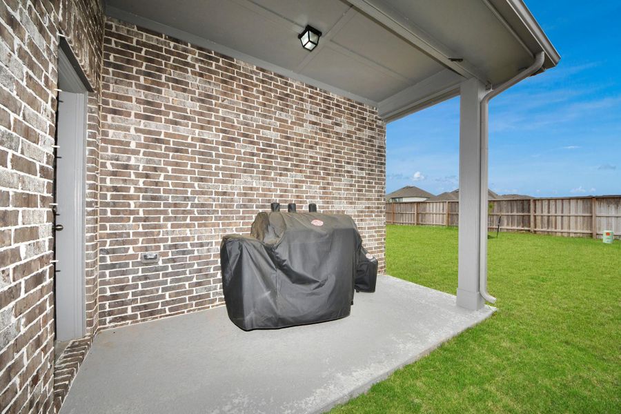 Covered patio for BBQ. Gas line upgrade for outdoor cooking.