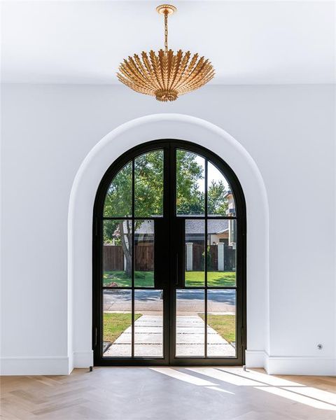 Doorway featuring light parquet floors