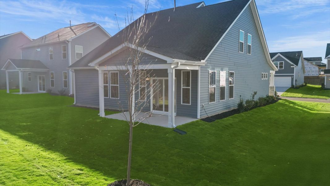 Warm and inviting outdoor living space with a covered rear porch and tasteful finishes Warm and inviting outdoor living space with a covered rear porch and tasteful finishes