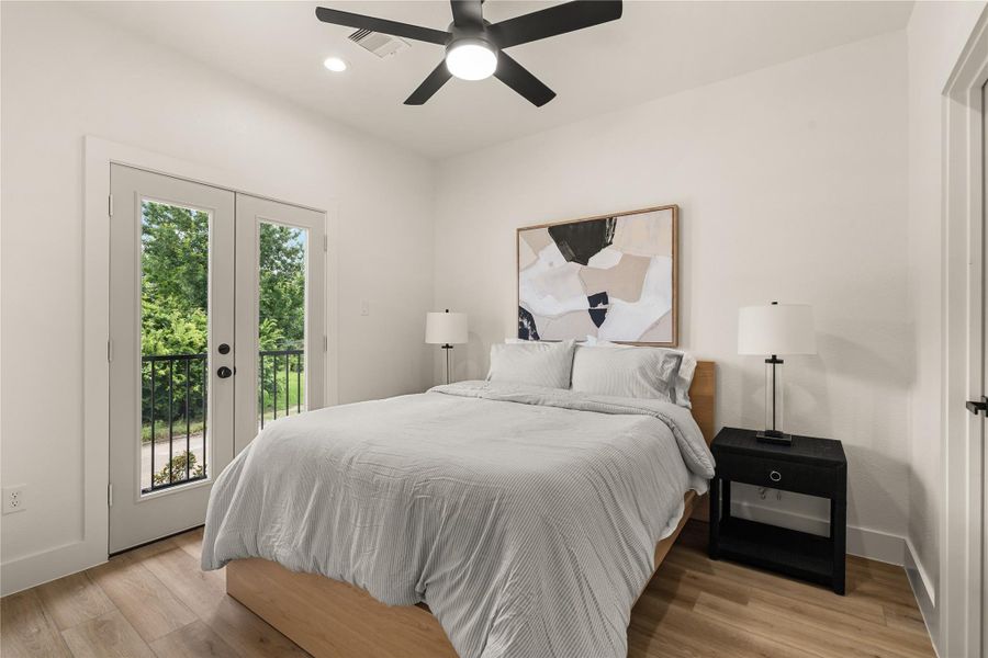 Third bedroom with French doors to a private balcony — green views just outside Third bedroom with French doors to a private balcony — green views just outside