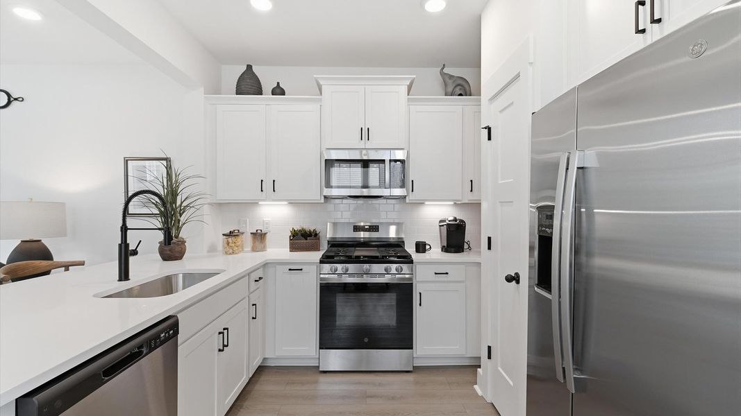 Exclusive DRB Homes kitchen with a stainless steel appliances and elevated finishes in a prime location