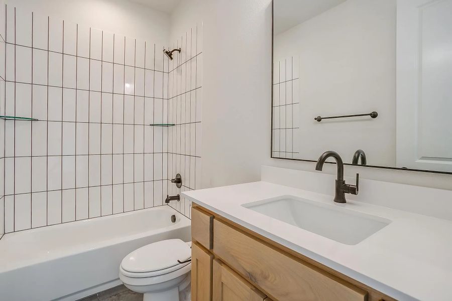 Representative furnished interior of a home built from the The Blaire by Elmwood Custom Homes in Matthews Farm, Venus (Image 19).