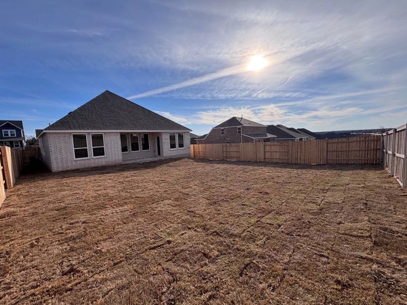 Exterior details and patio area of a home in The Colony, Bastrop (Image 16).