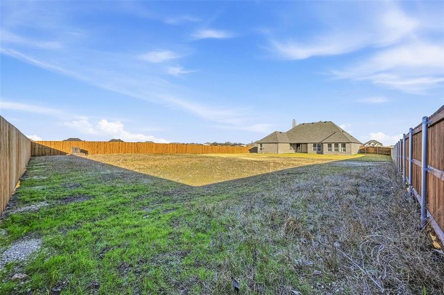 Exterior details and patio area of a home in Coyote Crossing, Godley (Image 4).