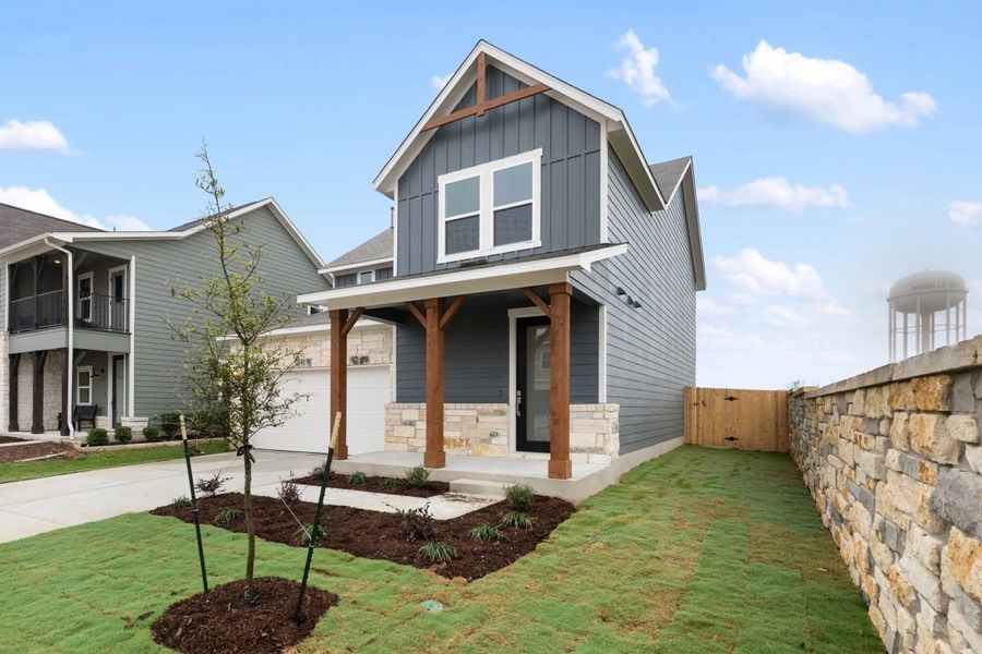 Front exterior of a new home in Covered Bridge, Hutto, TX, highlighting curb appeal (Image 19).