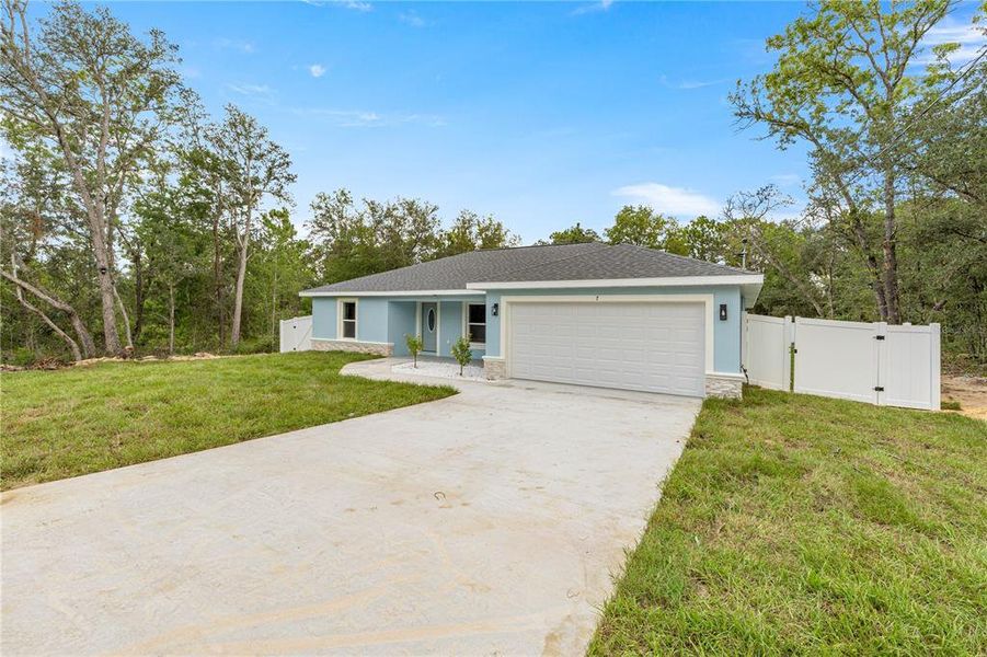 Front exterior of a new home in , Ocklawaha, FL, highlighting curb appeal (Image 1). Front exterior of a new home in , Ocklawaha, FL, highlighting curb appeal (Image 1).