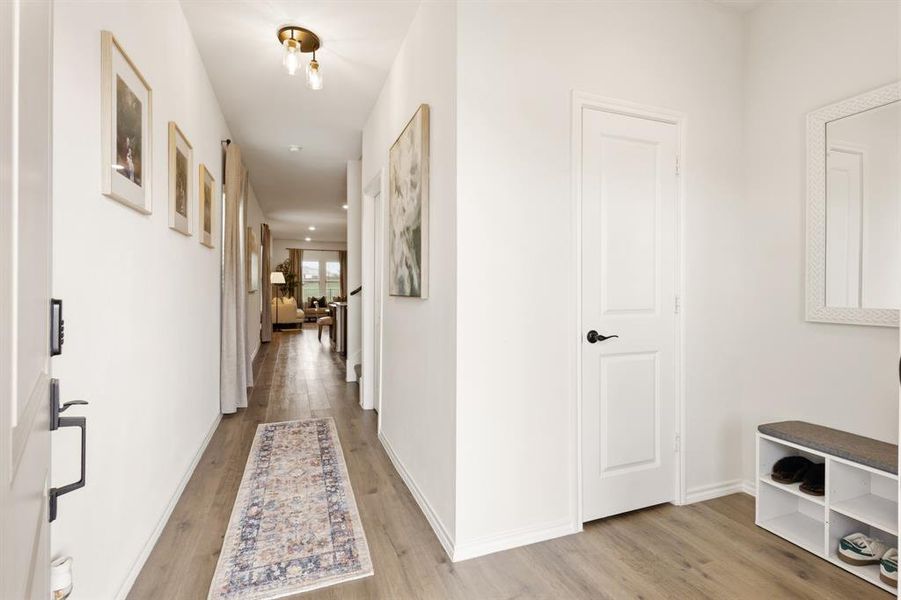 This inviting entryway features beautiful light wood flooring and stylish decorative lighting, setting the tone with a clean, bright, and effortlessly welcoming first impression This inviting entryway features beautiful light wood flooring and stylish decorative lighting, setting the tone with a clean, bright, and effortlessly welcoming first impression