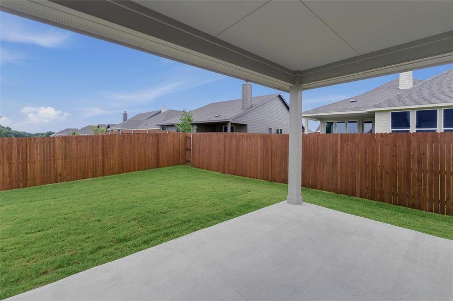 Covered patio featuring a concrete slab and support columns
