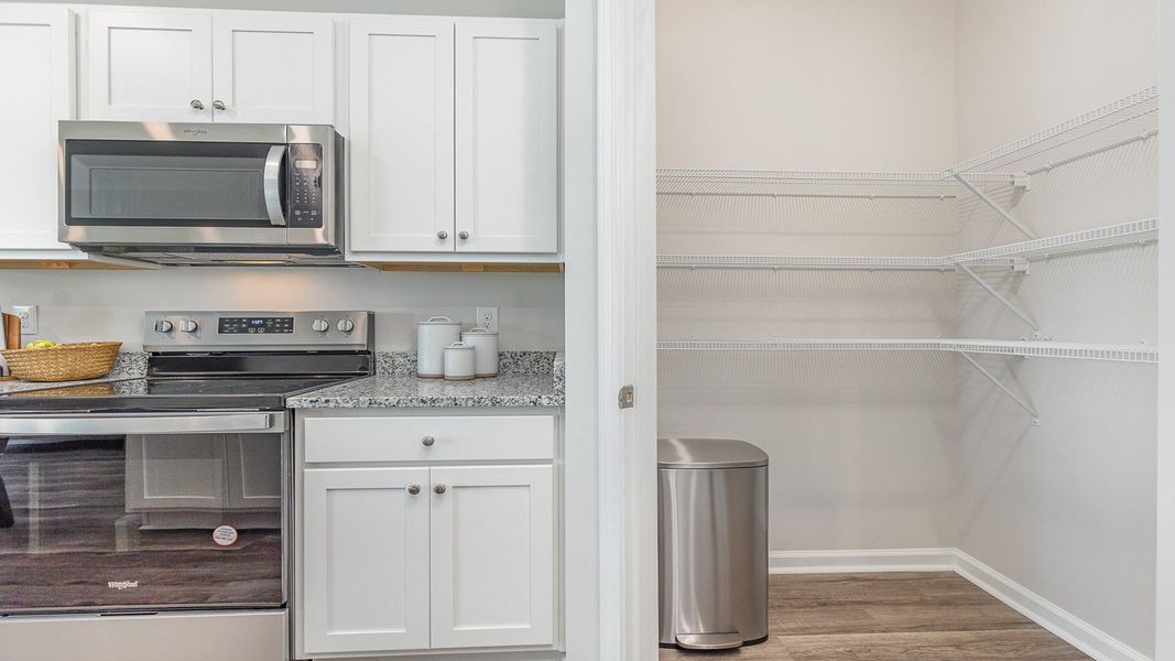 Furnished interior view inside a new home in Brunswick Plantation, Ash (Image 14).