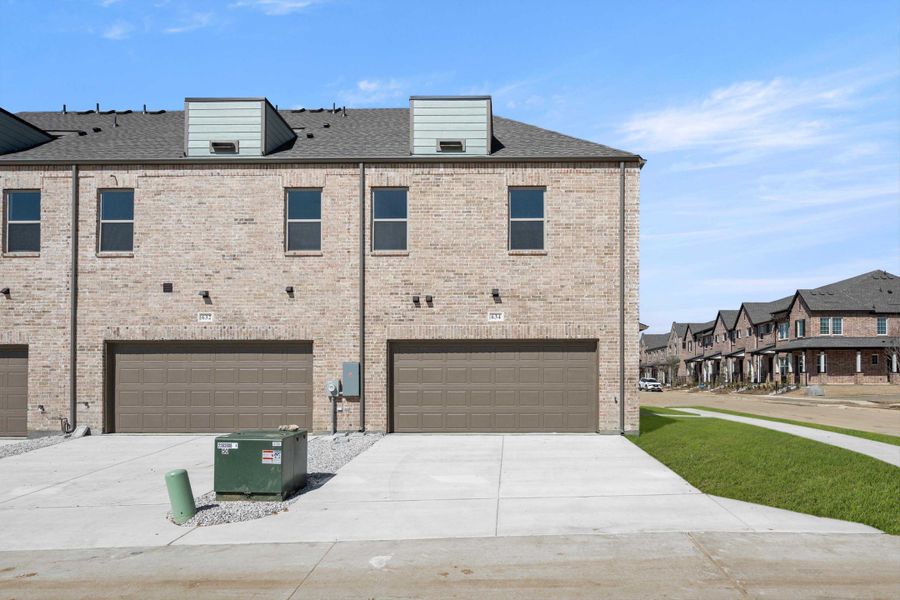 Representative exterior photo of a completed home built from the Darmouth by Ashton Woods in Parkside, Mansfield, TX (Image 19).