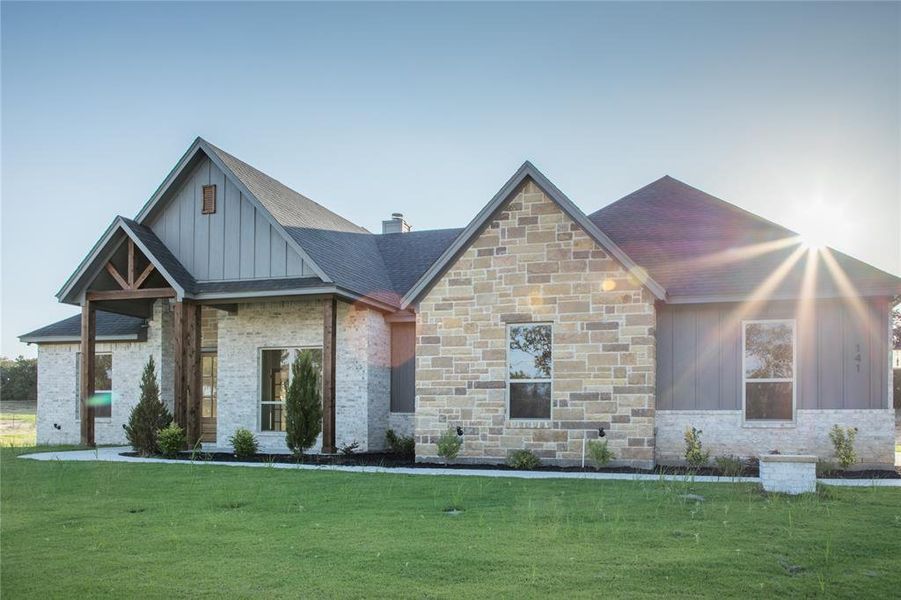 Front exterior of a new home in , Poolville, TX, highlighting curb appeal (Image 13).