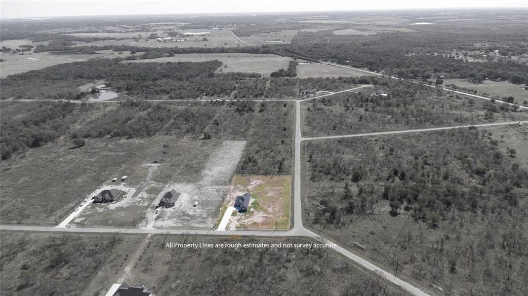 Aerial view of property and surrounding area with property boundaries highlighted