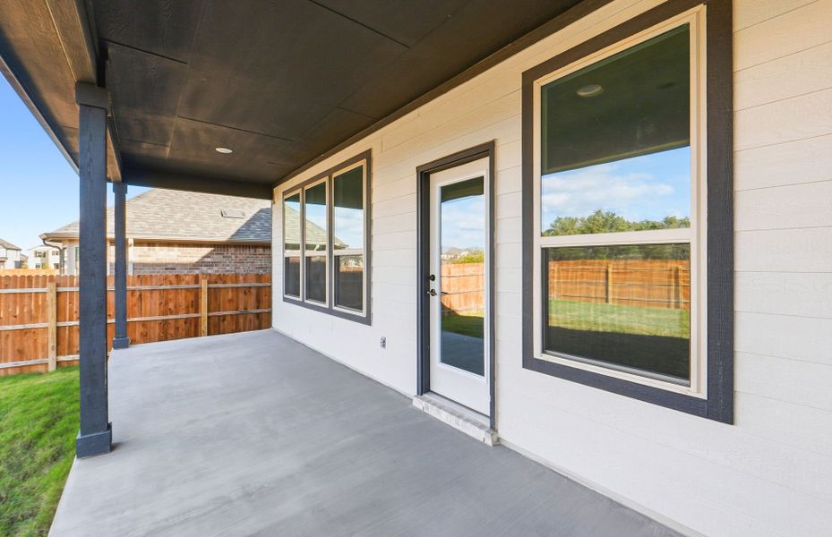 Exterior details and patio area of a home in Saddleback at Santa Rita Ranch, Liberty Hill (Image 25).