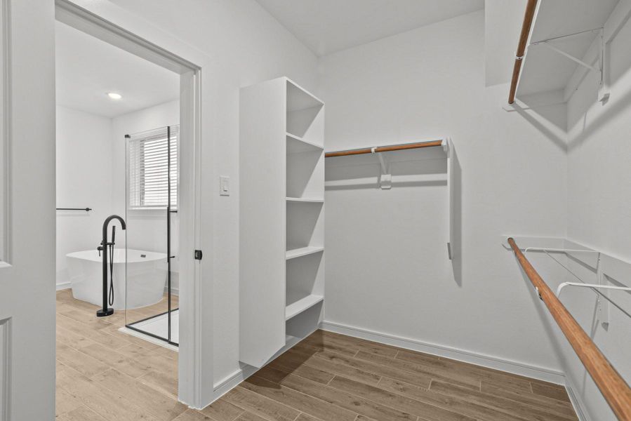 Primary walk-in closet (*Photo not of actual home and used for illustration purposes only.)
