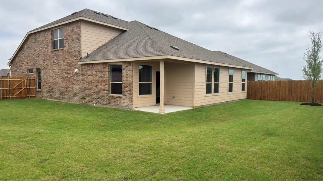 Exterior details and patio area of a home in Bluestem, Rhome (Image 2). Exterior details and patio area of a home in Bluestem, Rhome (Image 2).