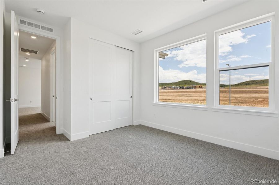 Spacious, unfurnished interior of a new home in Storytellers at Lyric, Lone Tree (Image 39).