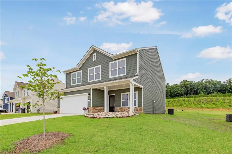 Front exterior of a new home in , Calhoun, GA, highlighting curb appeal (Image 2). Front exterior of a new home in , Calhoun, GA, highlighting curb appeal (Image 2).