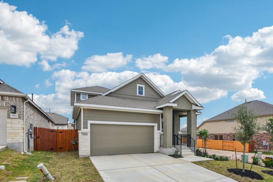 Front exterior of a new home in Meyer Ranch, New Braunfels, TX, highlighting curb appeal (Image 22).
