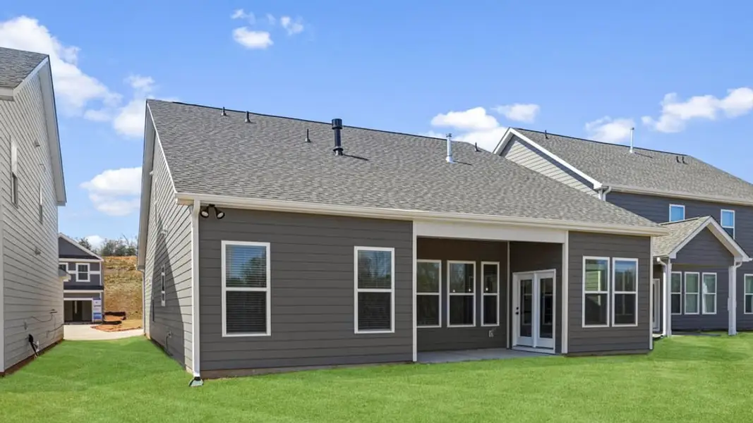 Exterior details and patio area of a home in Whitehawk Meadows, Travelers Rest (Image 3).