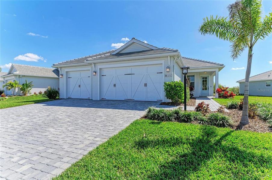 Front exterior of a new home in , Sarasota, FL, highlighting curb appeal (Image 1). Front exterior of a new home in , Sarasota, FL, highlighting curb appeal (Image 1).