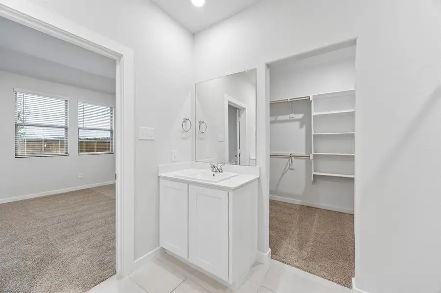 Primary Bathroom in the Cedar home plan by Trophy Signature Homes – REPRESENTATIVE PHOTO