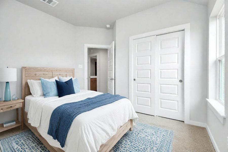 Generously sized secondary bedrooms featuring spacious closets, soft and inviting carpeting underfoot, large windows allowing plenty of natural light. Sample photo of completed plan. As-built color and selections may vary. Generously sized secondary bedrooms featuring spacious closets, soft and inviting carpeting underfoot, large windows allowing plenty of natural light. Sample photo of completed plan. As-built color and selections may vary.