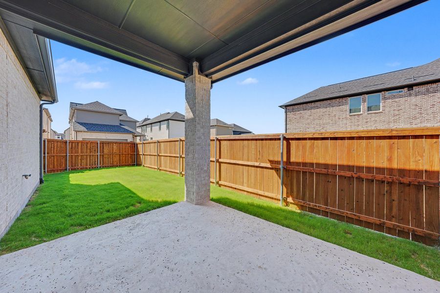 Exterior details and patio area of a home in Light Farms Brenham - 40' Lots, Celina (Image 3).
