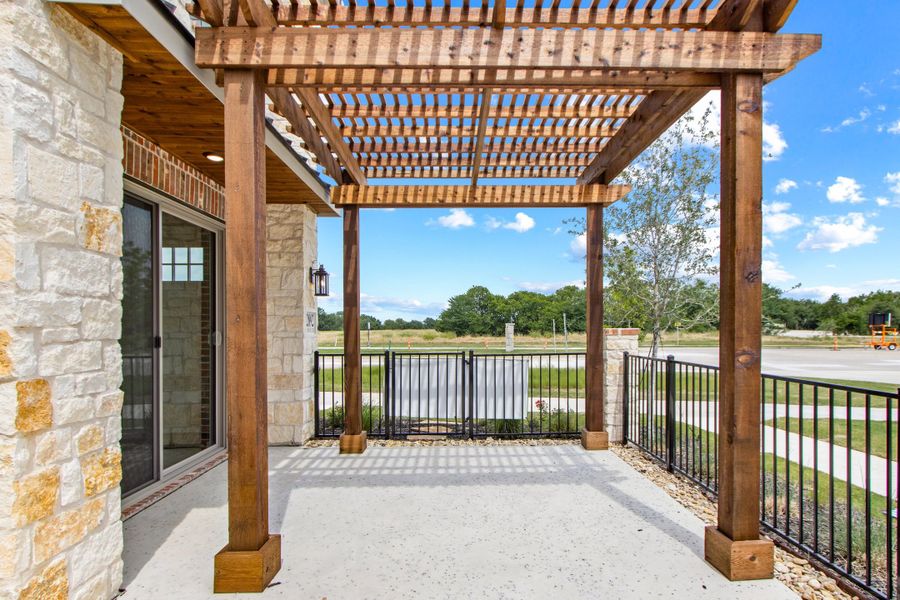 Exterior details and patio area of a home in The Tribute, The Colony (Image 26).