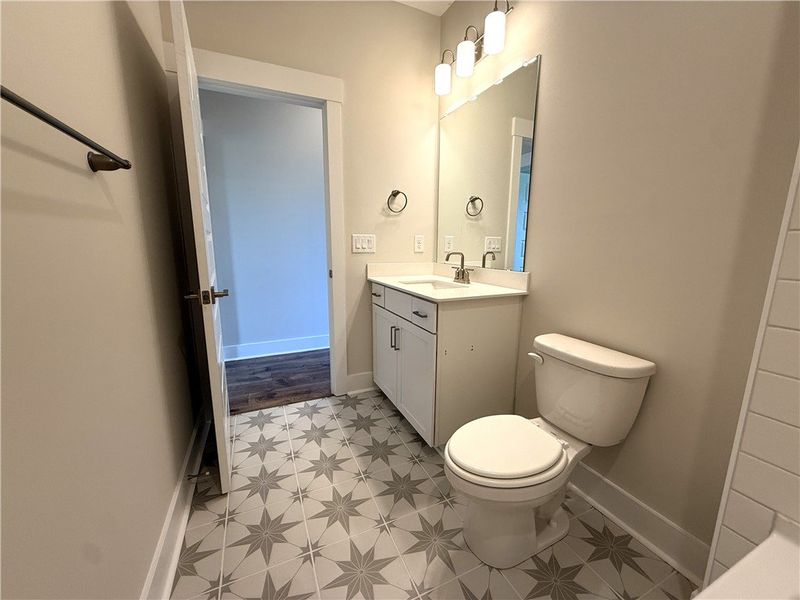 Well-appointed bath features a sleek vanity, mirro Well-appointed bath features a sleek vanity, mirro