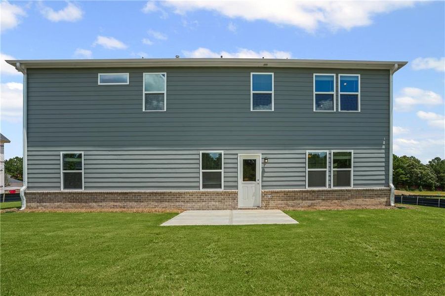 Front exterior of a new home in Haverhill Estates, Dacula, GA, highlighting curb appeal (Image 1).