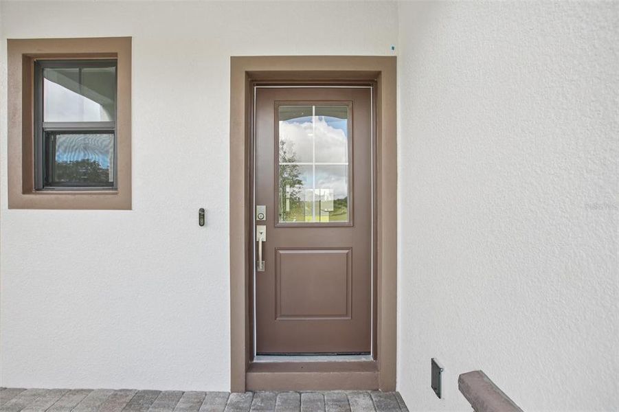 Exterior details and patio area of a home in Grasslands West, Lakeland (Image 3).