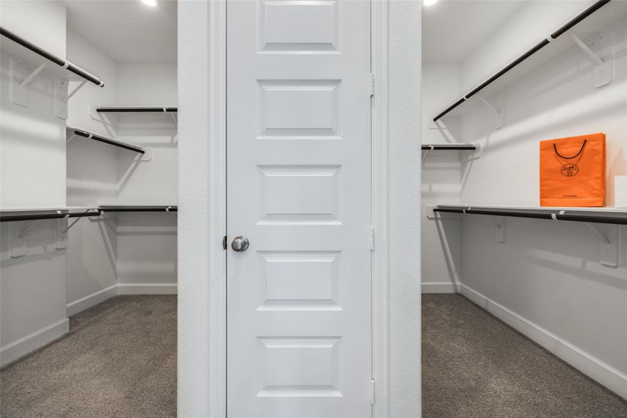 Large Closet with 2 separate sides, lots of hanging rails & extra closet with door
