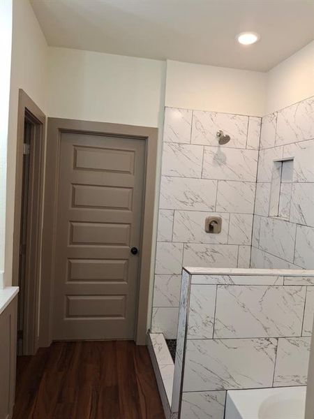 Full bathroom featuring a walk in shower, dark wood finished floors, a bathtub, vanity, and recessed lighting Full bathroom featuring a walk in shower, dark wood finished floors, a bathtub, vanity, and recessed lighting