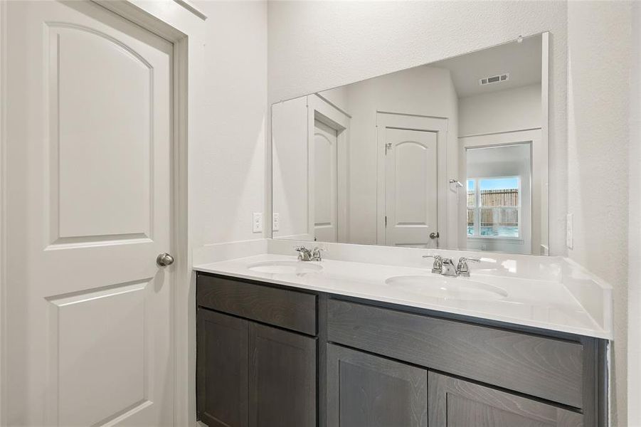 Bathroom featuring double vanity Bathroom featuring double vanity