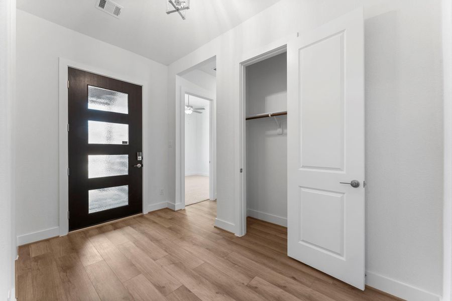 Secondary view of the entry with coat closet. Secondary view of the entry with coat closet.