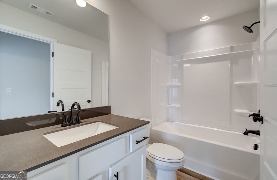 Furnished interior view inside a new home in Ponderosa Farms Reserve, Gainesville (Image 18).