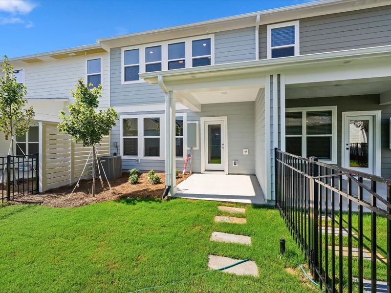 Exterior details and patio area of a home in North Creek Village - Townhomes, Huntersville (Image 3).