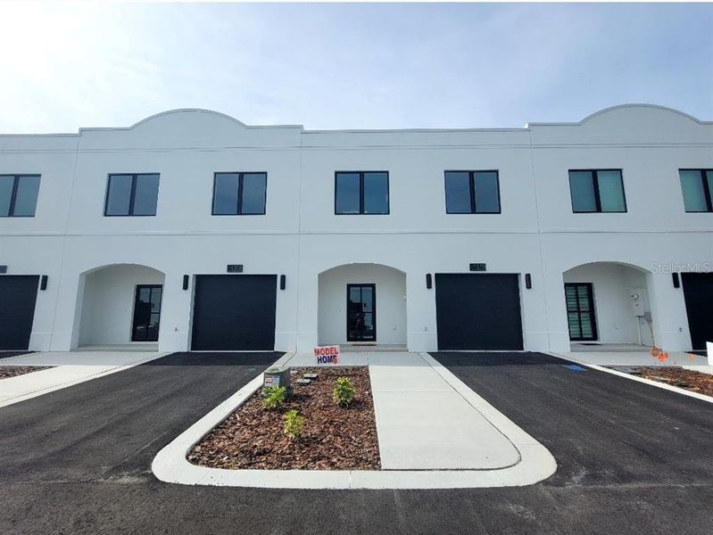 Front exterior of a new home in , Tampa, FL, highlighting curb appeal (Image 1). Front exterior of a new home in , Tampa, FL, highlighting curb appeal (Image 1).