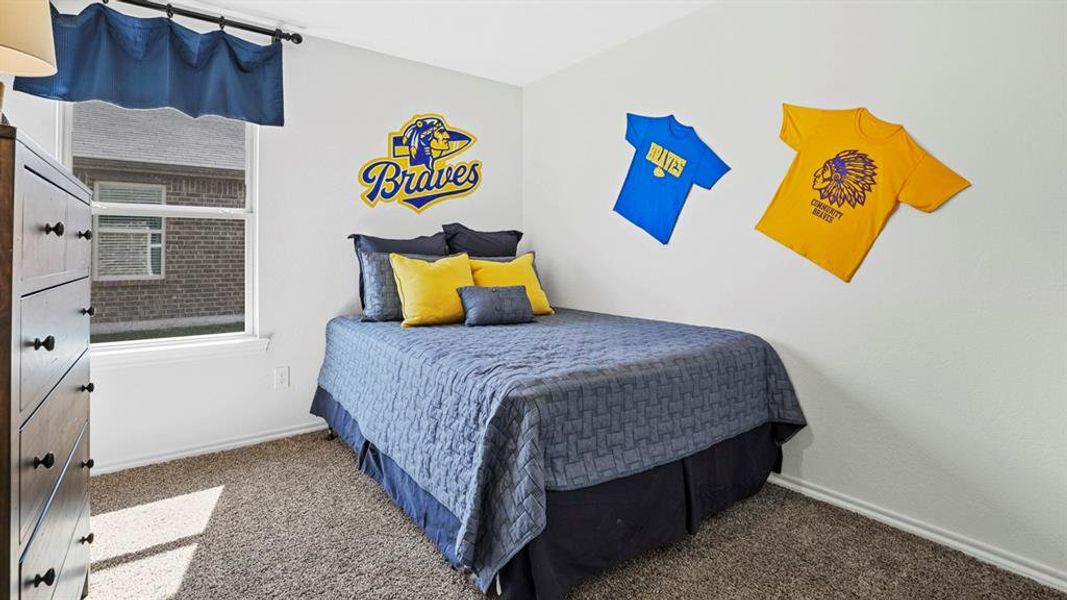 Bedroom featuring light-colored walls and carpet flooring