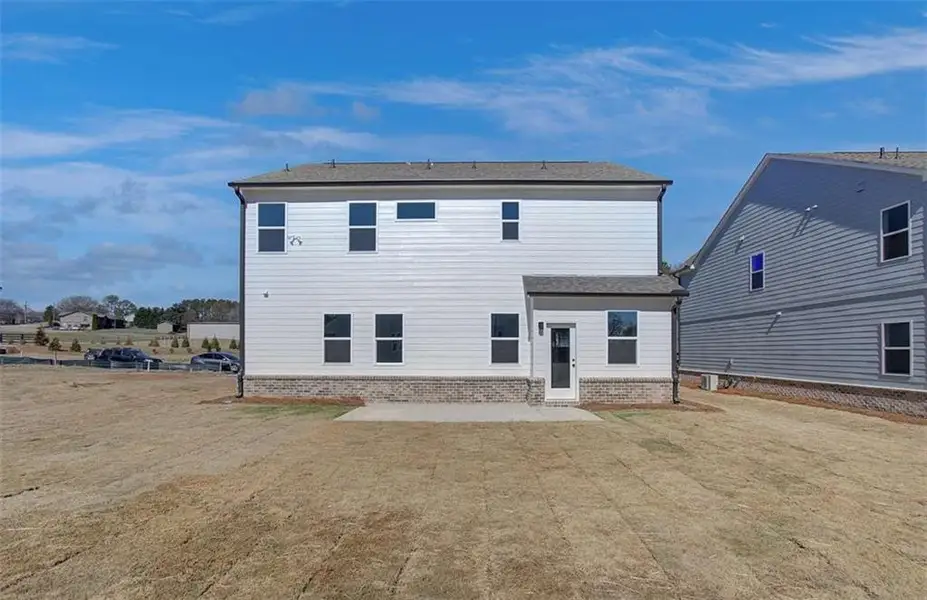 Exterior details and patio area of a home in The Paddocks at Doc Hughes, Buford (Image 4).