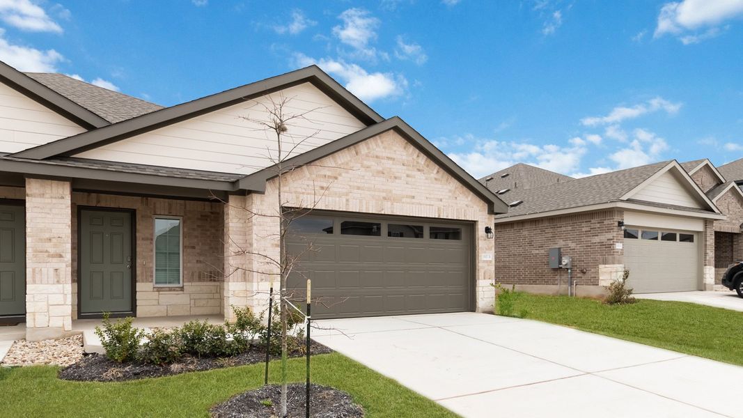 Representative exterior photo of a completed home built from the The Juniper by D.R. Horton in Palomino, Manor, TX (Image 15).