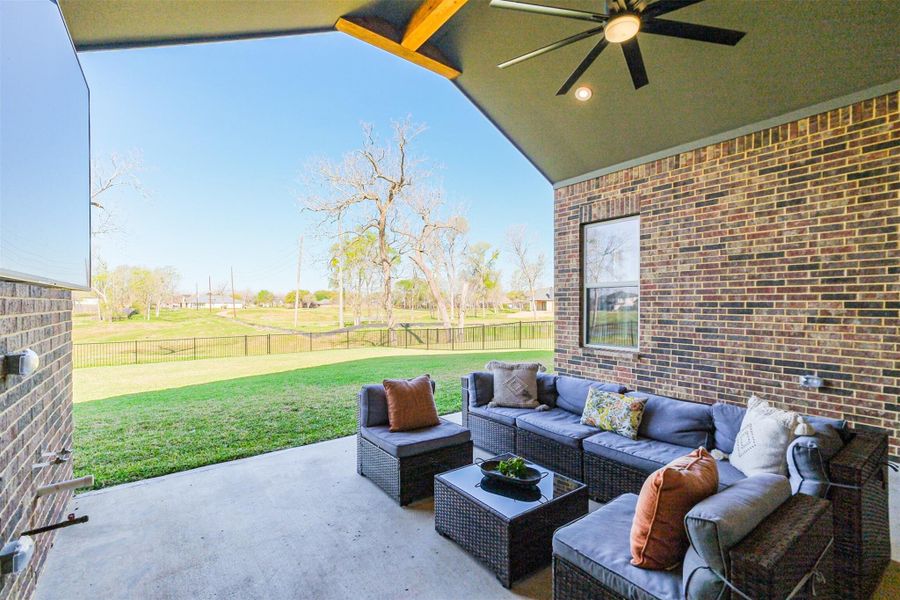Beautiful covered back patio to relax and view the setting sun with no direct back neighbor.