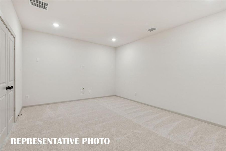 This wonderful media room paired with adjacent game room creates the ultimate entertainment zone!  REPRESENTATIVE PHOTO