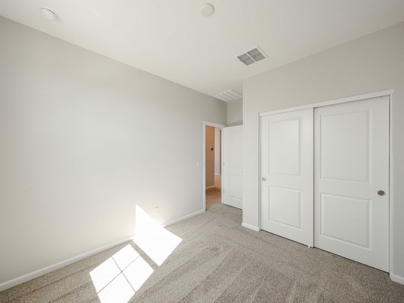 A hallway with white doors. A hallway with white doors.