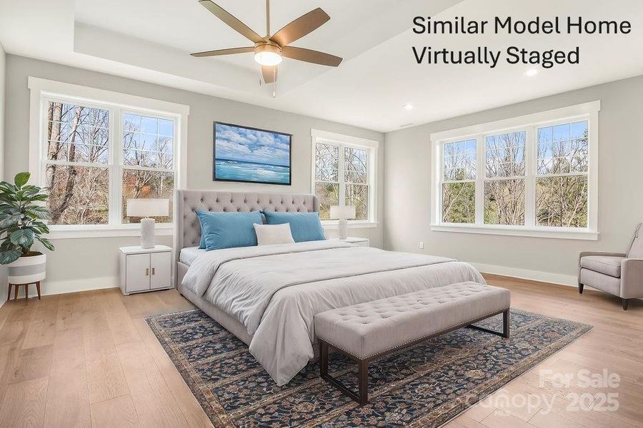 Primary Suite with tray ceiling and ceiling fans Primary Suite with tray ceiling and ceiling fans